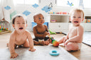 3 cute baby's wearing Woosh diapers